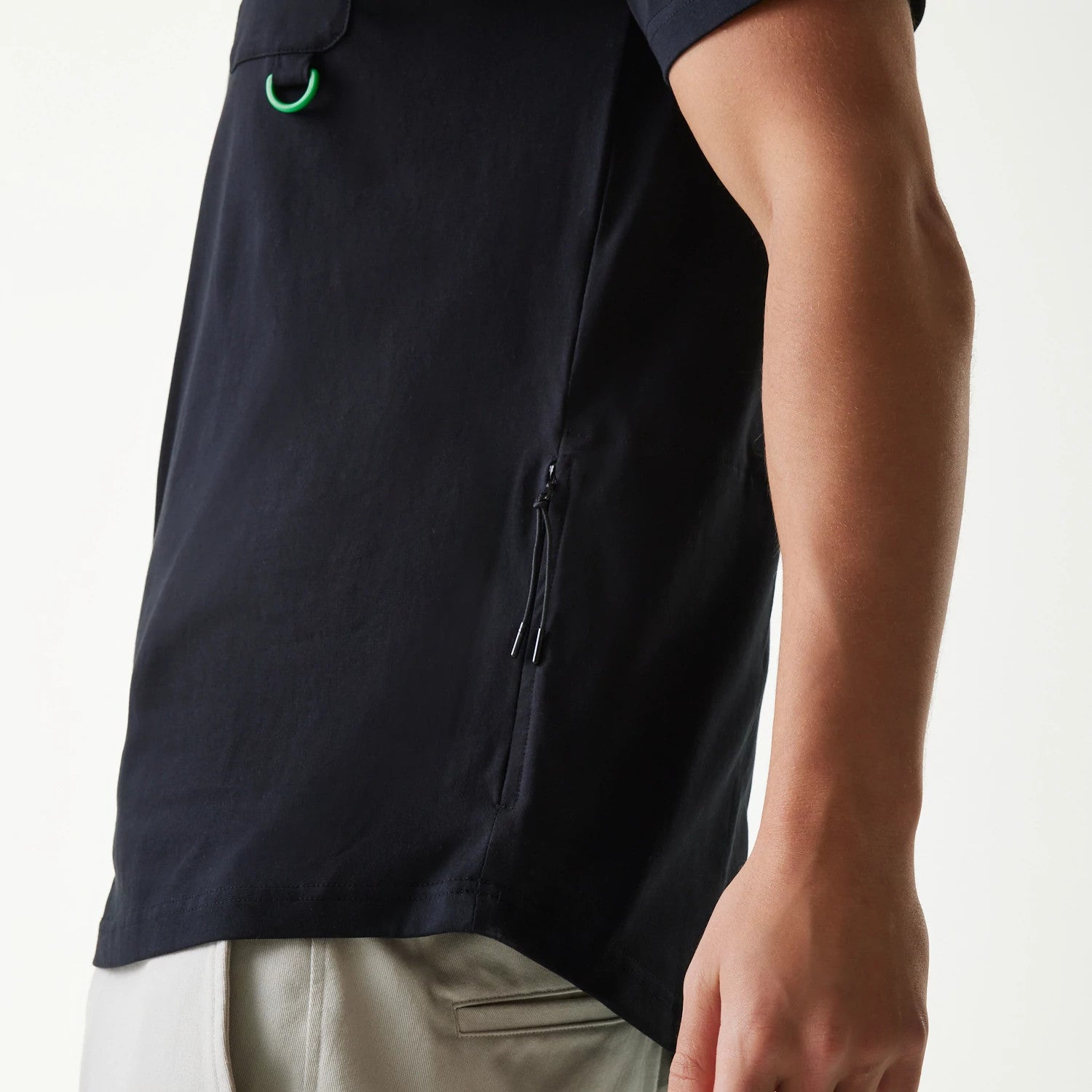 The Male model is wearing New Era Outdoor Earth Day Black Side Pocket T-Shirt 4