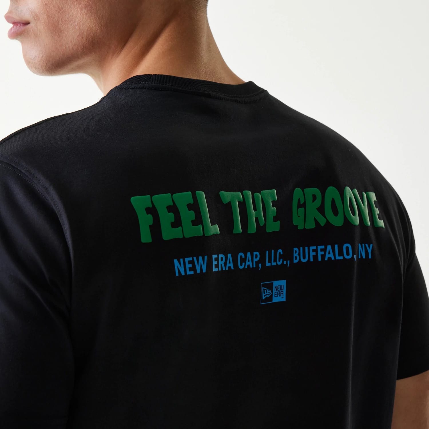The Male model is wearing New Era Outdoor Earth Day Black Side Pocket T-Shirt 5