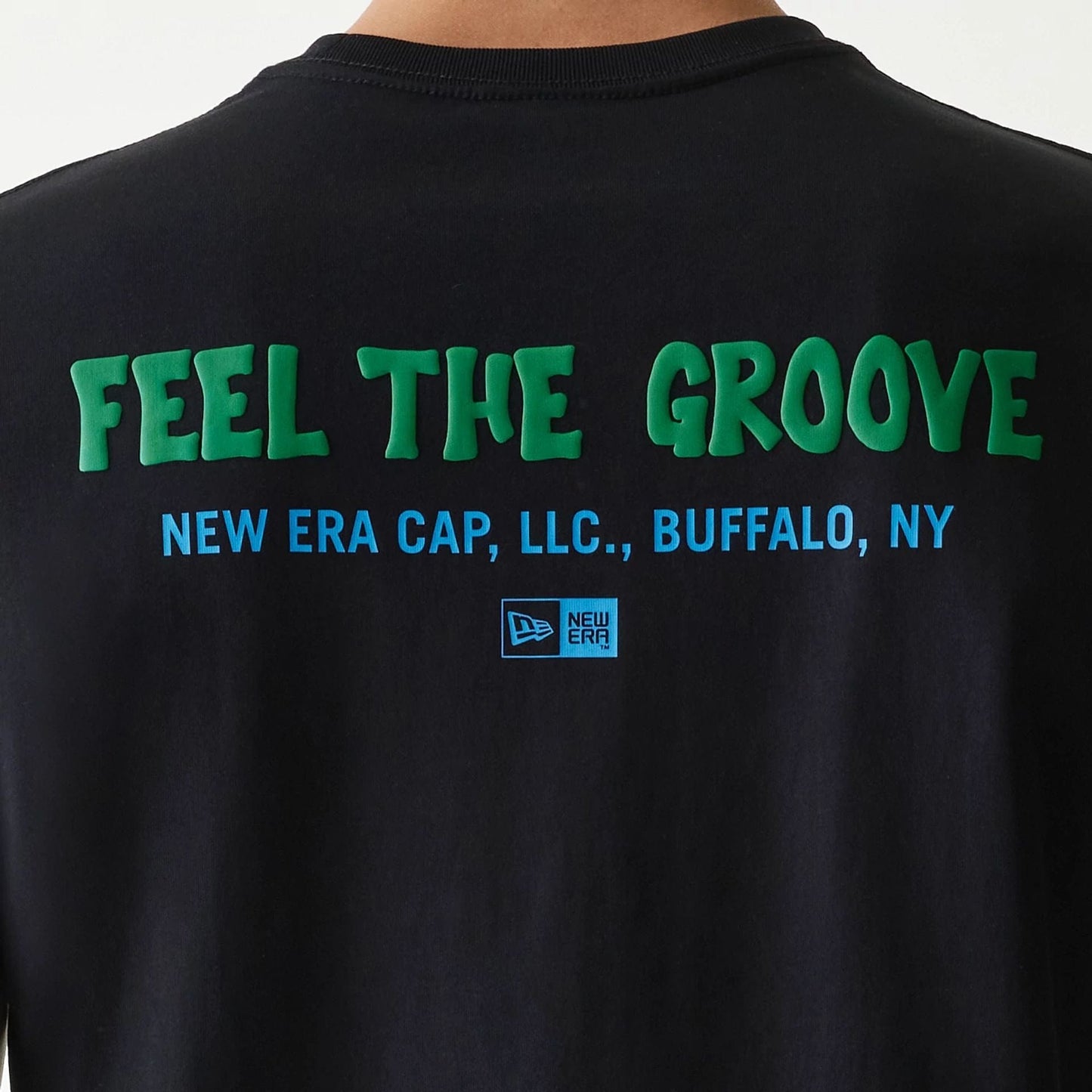 The Male model is wearing New Era Outdoor Earth Day Black Side Pocket T-Shirt 6