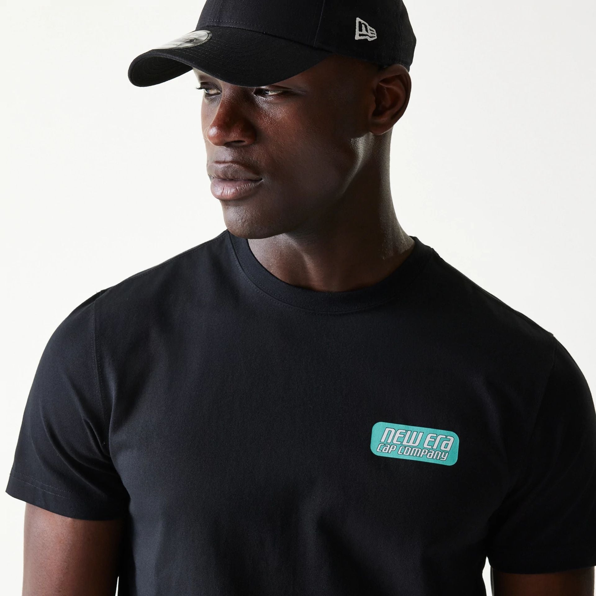 The Male model is wearing New Era Classic Black T-Shirt 5