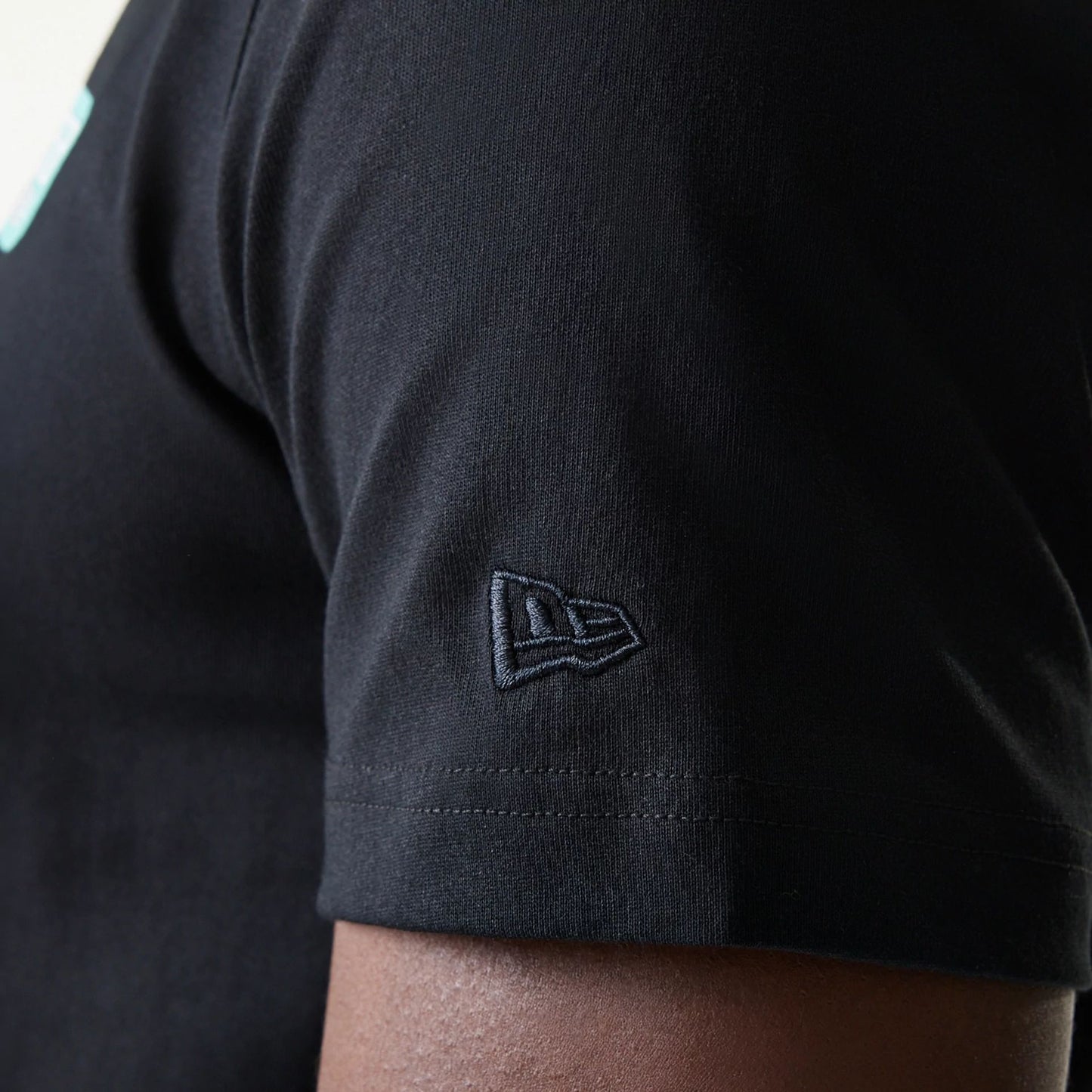 The Male model is wearing New Era Classic Black T-Shirt 7