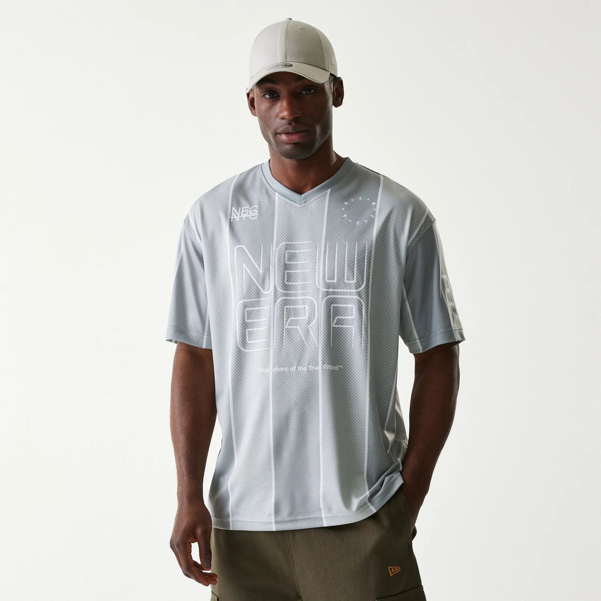The Male model is wearing New Era City Sport Grey T-Shirt 1