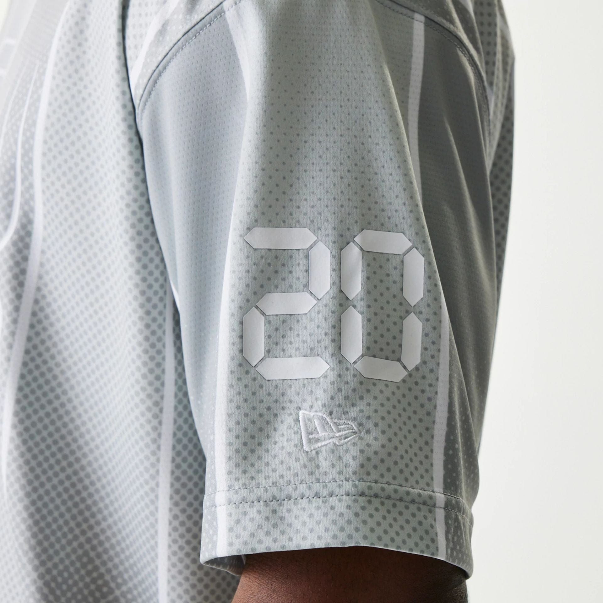 The Male model is wearing New Era City Sport Grey T-Shirt 5