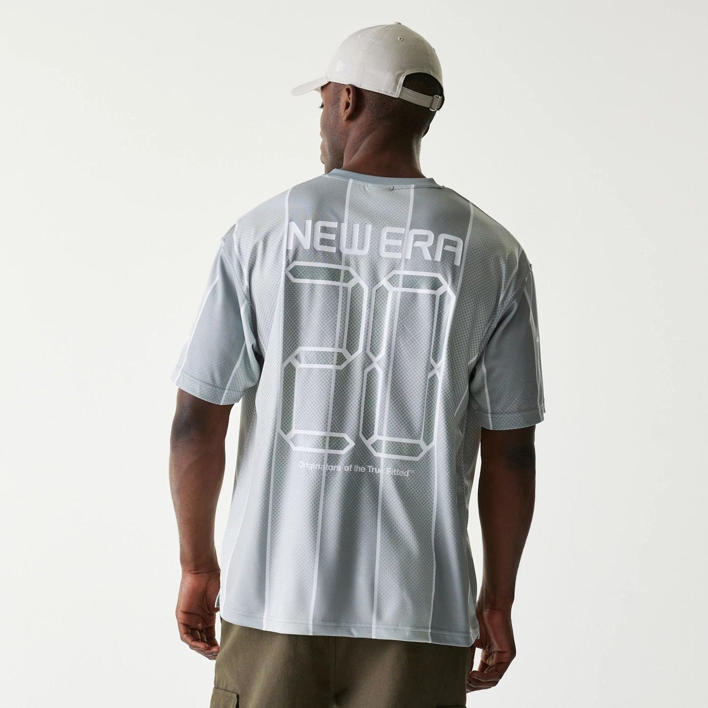 The Male model is wearing New Era City Sport Grey T-Shirt 2