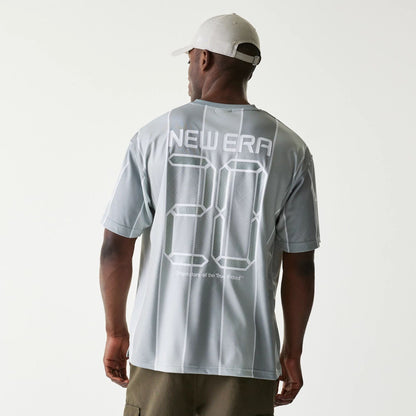 The Male model is wearing New Era City Sport Grey T-Shirt 2