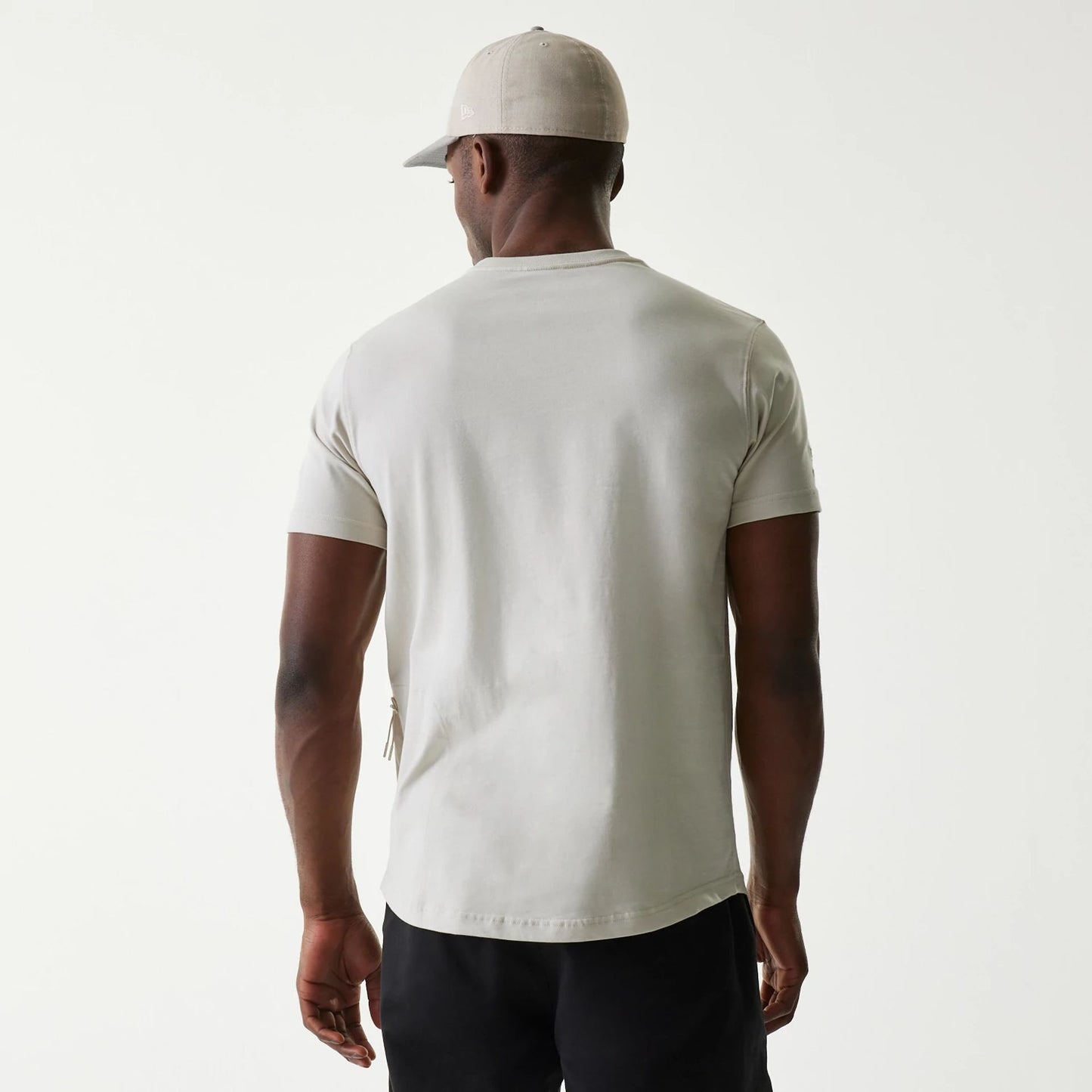 The Male model is wearing New Era Outdoor Earth Day Stone T-Shirt 2