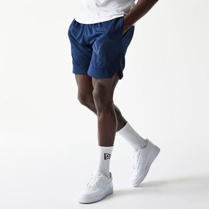 The Male model is wearing New York Yankees Tonal Pack Blue Shorts 6