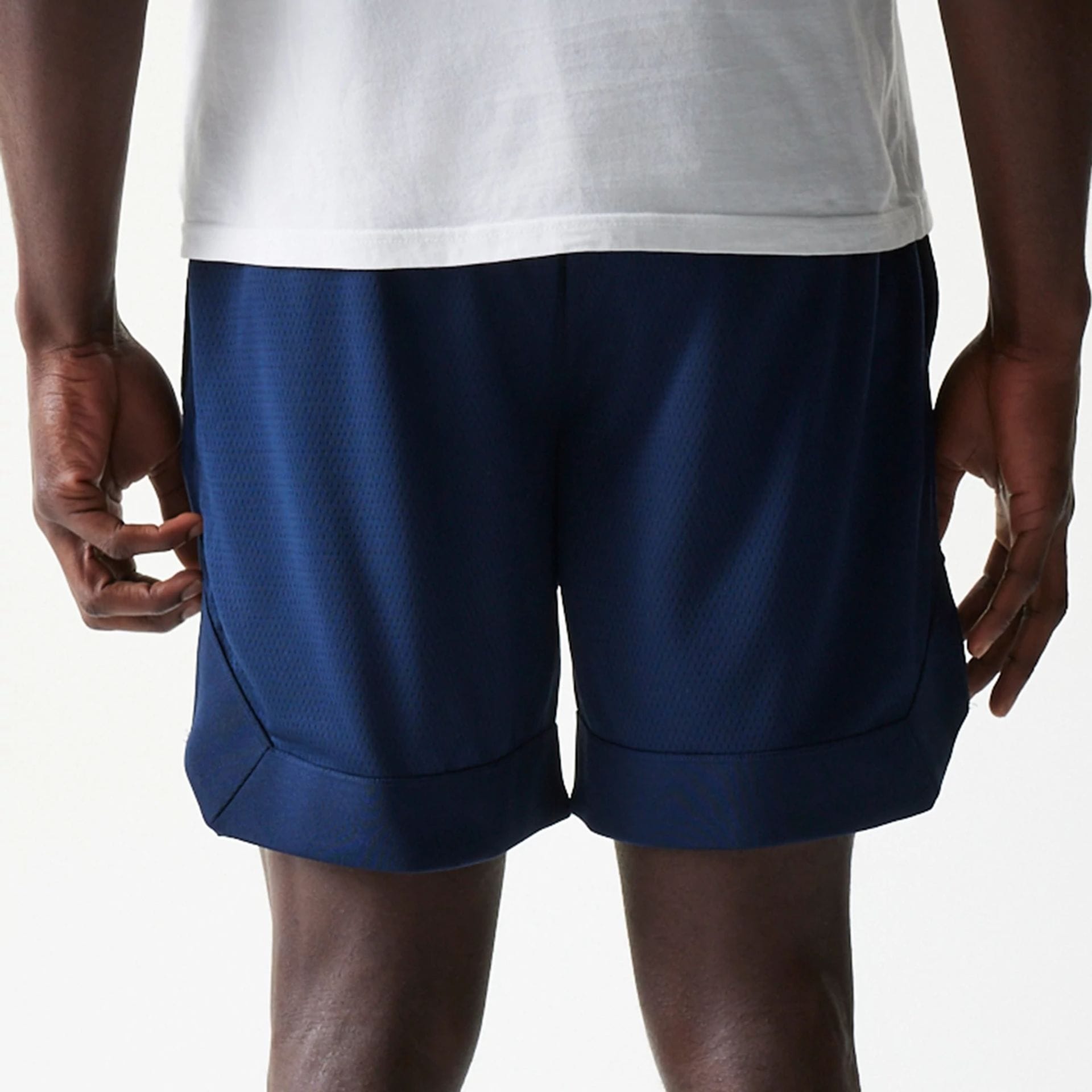 The Male model is wearing New York Yankees Tonal Pack Blue Shorts 7