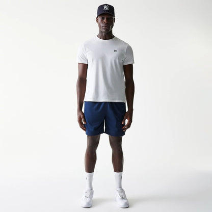 The Male model is wearing New York Yankees Tonal Pack Blue Shorts 8