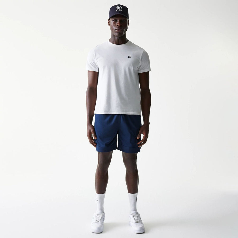 The Male model is wearing New York Yankees Tonal Pack Blue Shorts 8