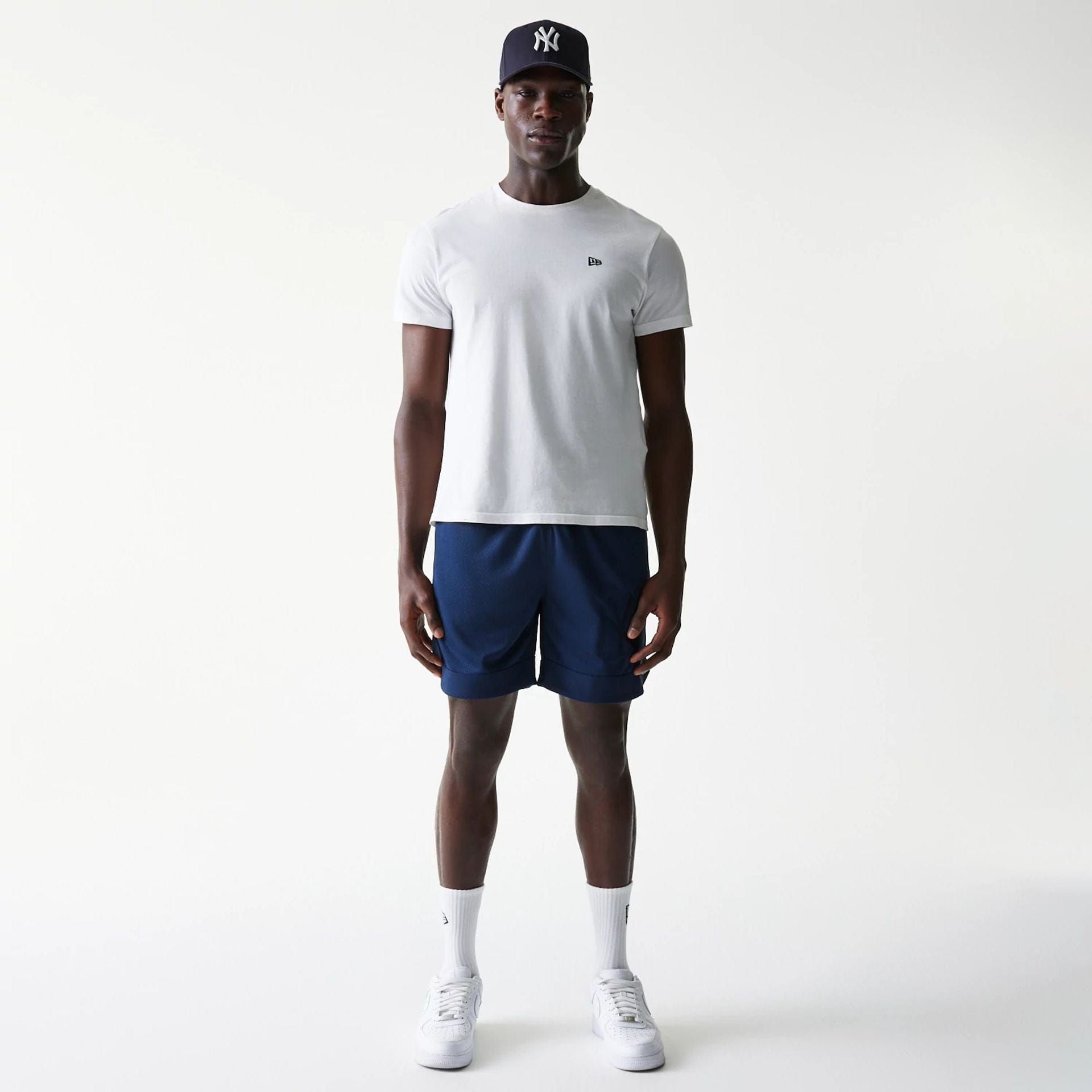 The Male model is wearing New York Yankees Tonal Pack Blue Shorts 8