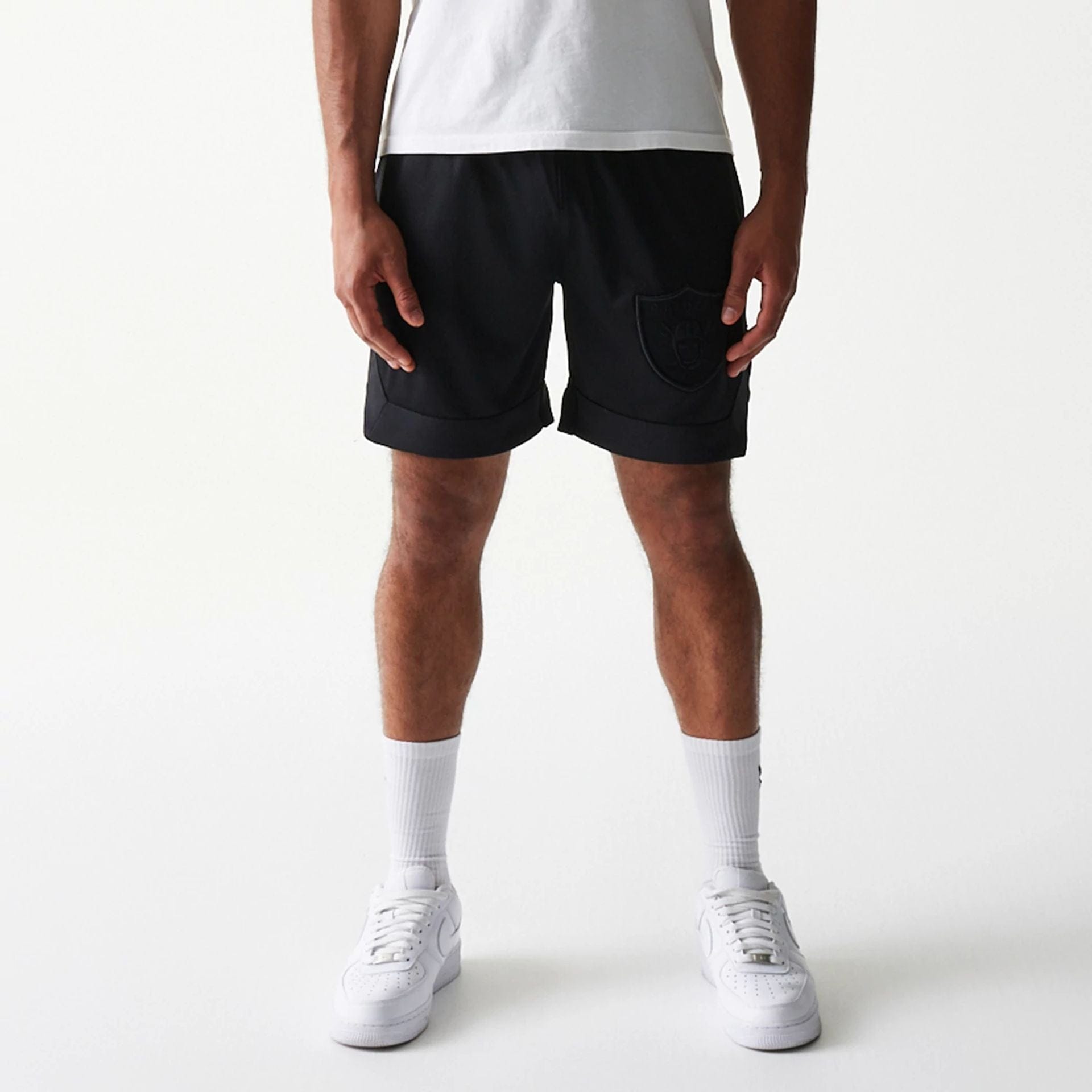 The Male model is wearing Las Vegas Raiders Tonal Pack Black Shorts 1