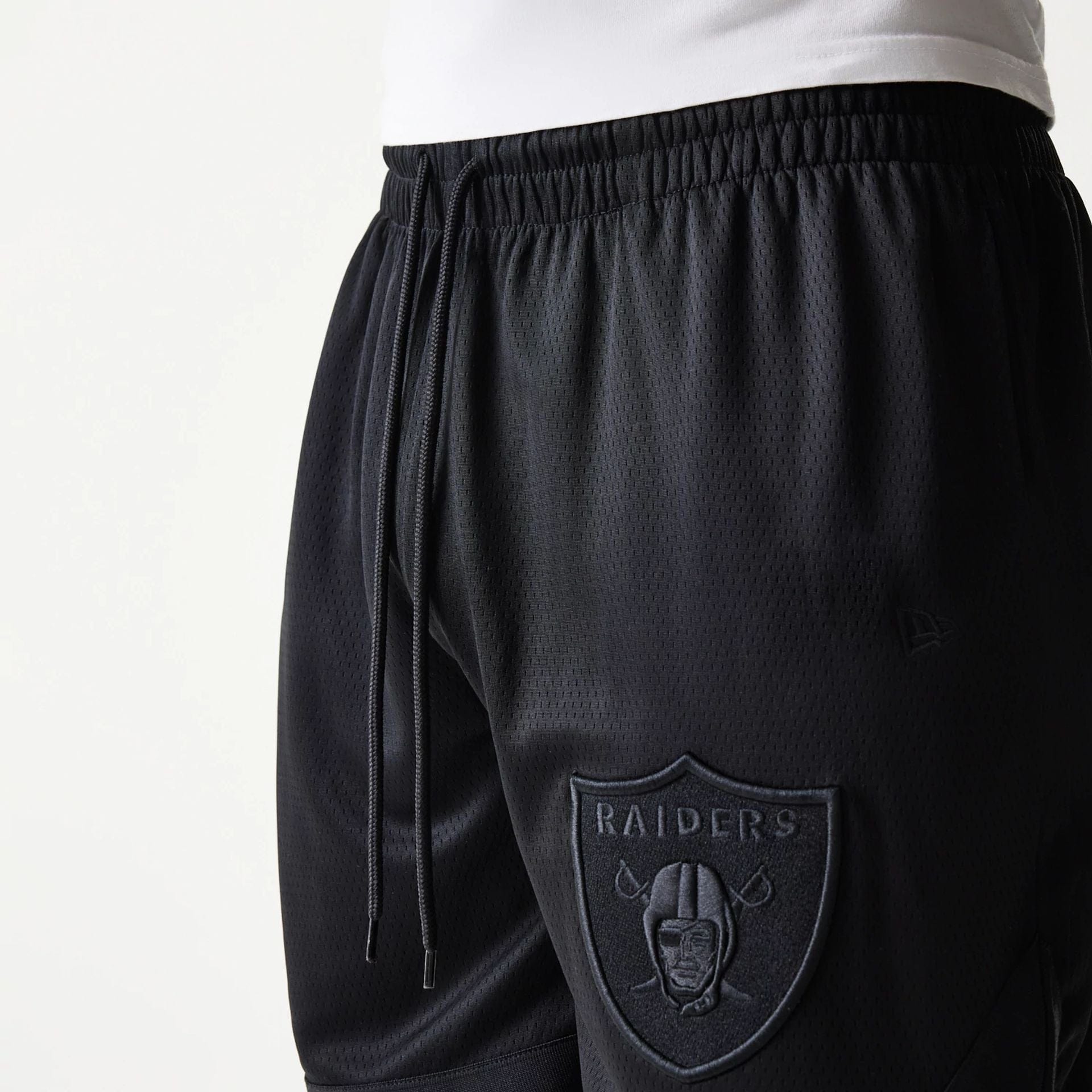 The Male model is wearing Las Vegas Raiders Tonal Pack Black Shorts 5