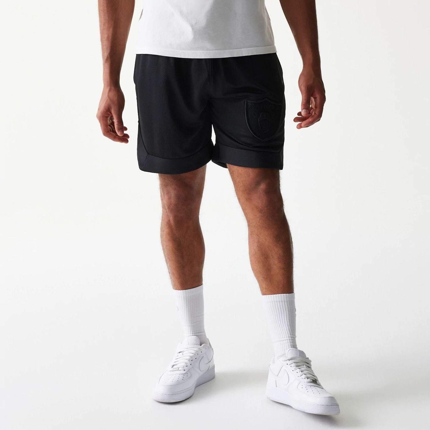 The Male model is wearing Las Vegas Raiders Tonal Pack Black Shorts 6