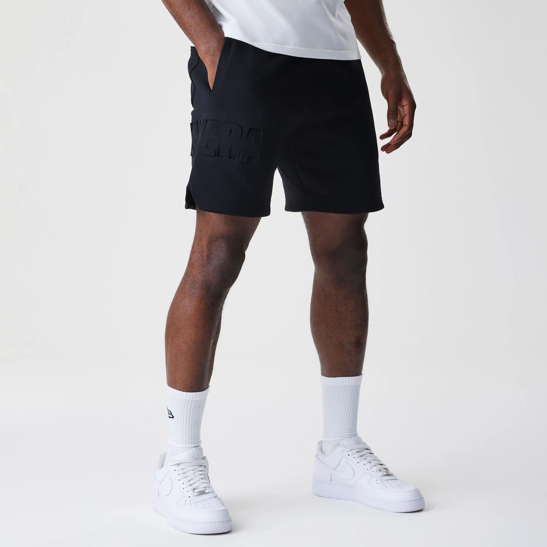 The Male model is wearing New Era Tonal Pack Black Shorts 4