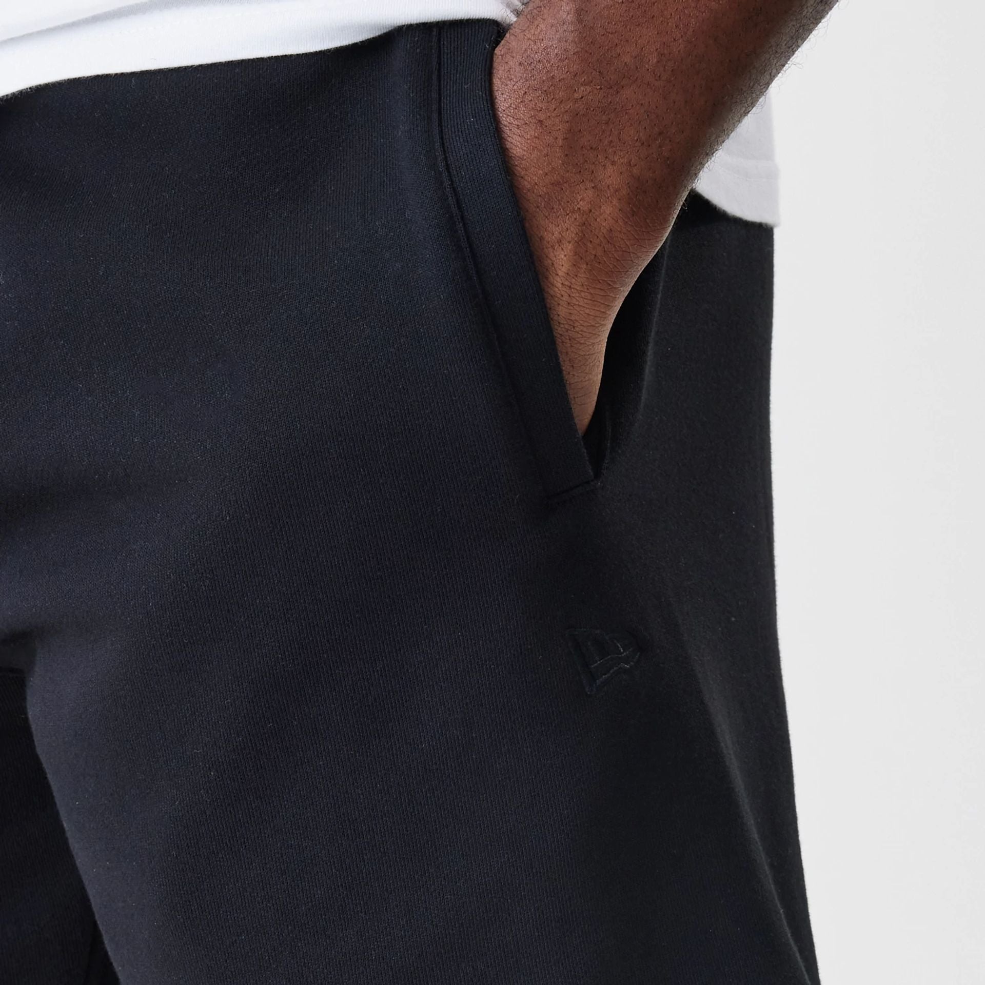 The Male model is wearing New Era Tonal Pack Black Shorts 3