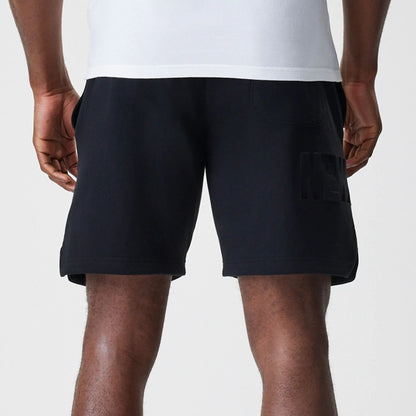 The Male model is wearing New Era Tonal Pack Black Shorts 6