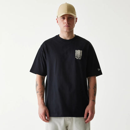 The Male model is wearing New Era Marine Life Club Black Oversized T-Shirt 1
