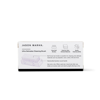 Jason Markk® Ultra Delicates Wooden Cap Brush, front view showing the packaging with product name, usage instructions, and illustration of the brush with soft bristles and bamboo wood handle.