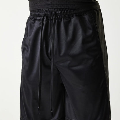 The Male model is wearing New Era Retro Sports Black Mesh Shorts 3