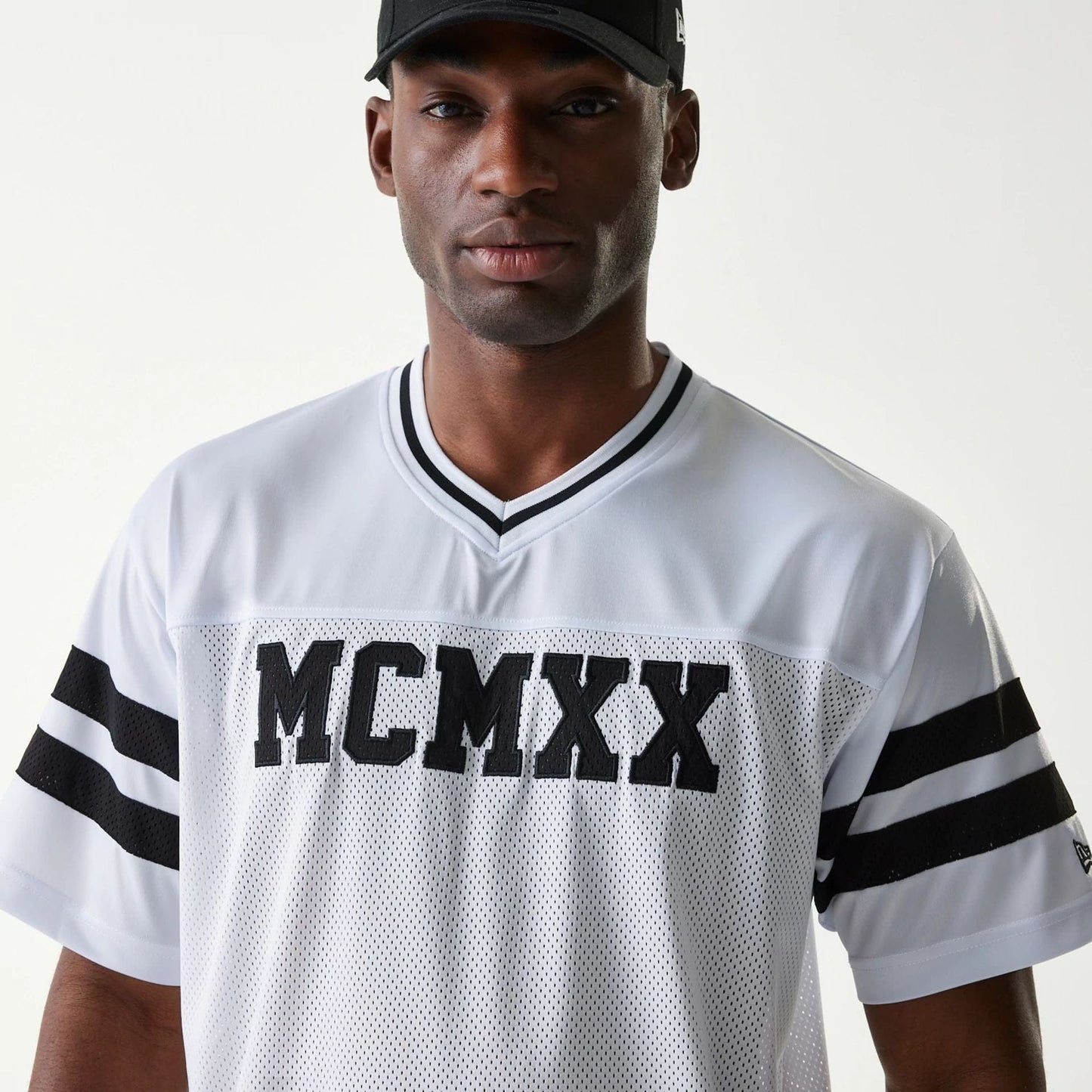 The Male model is wearing New Era Retro Sports White Mesh Jersey 3