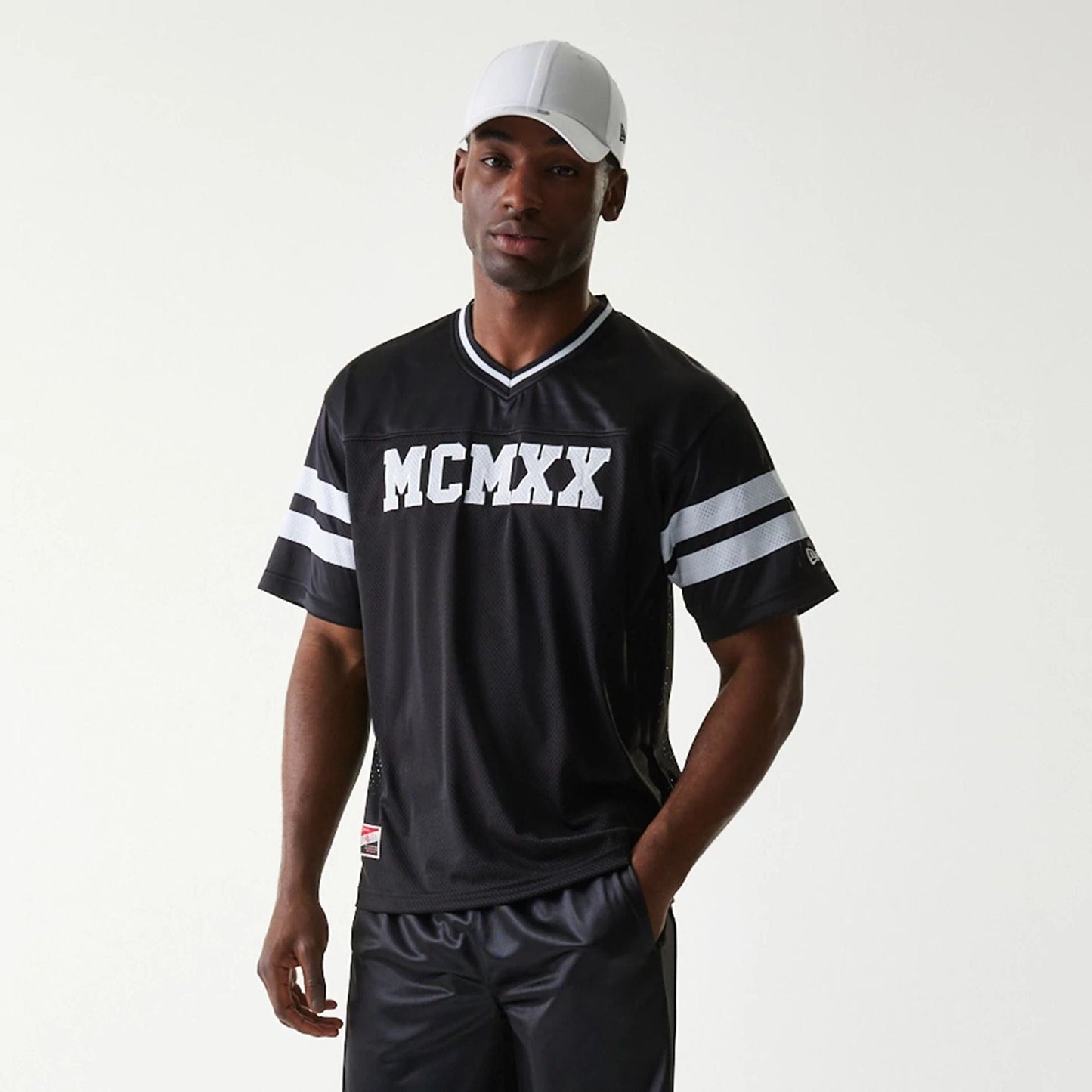 The Male model is wearing New Era Retro Sports Black Mesh Jersey 7