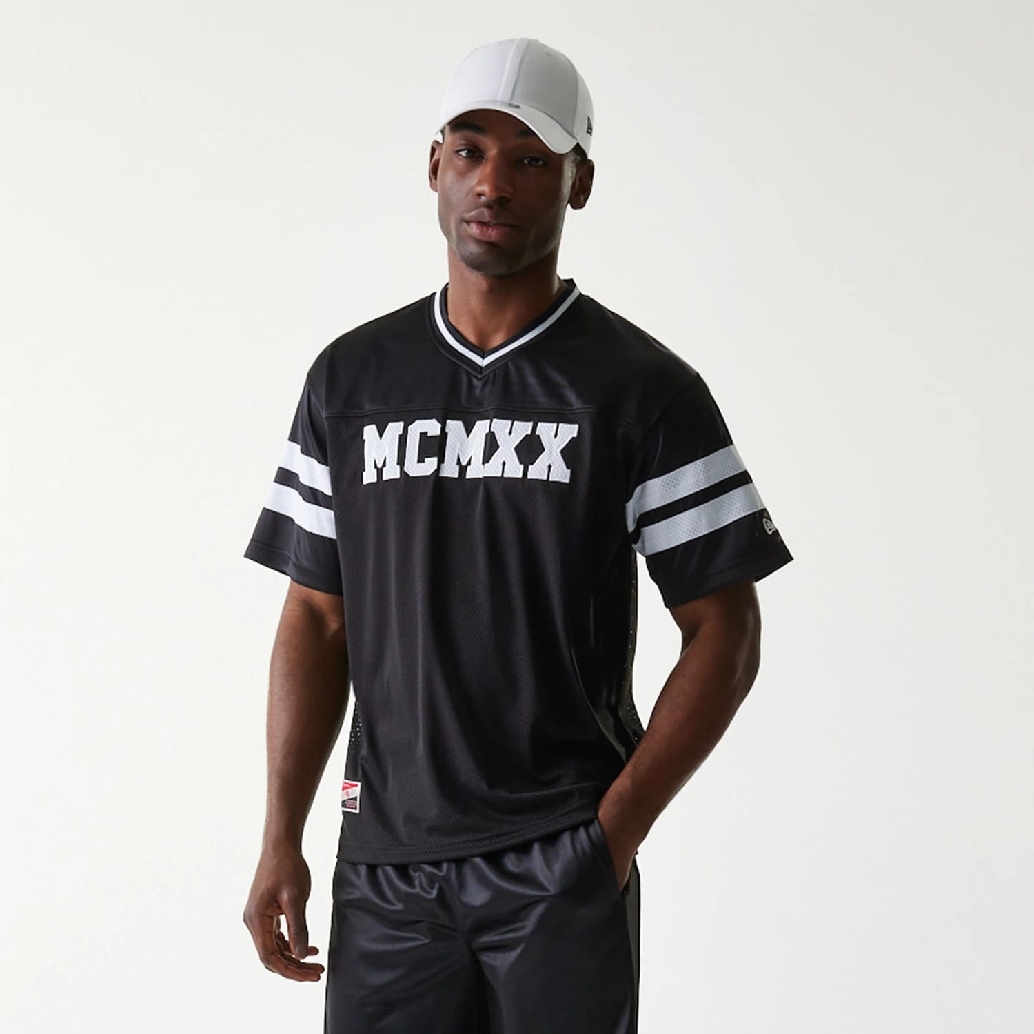 The Male model is wearing New Era Retro Sports Black Mesh Jersey 7