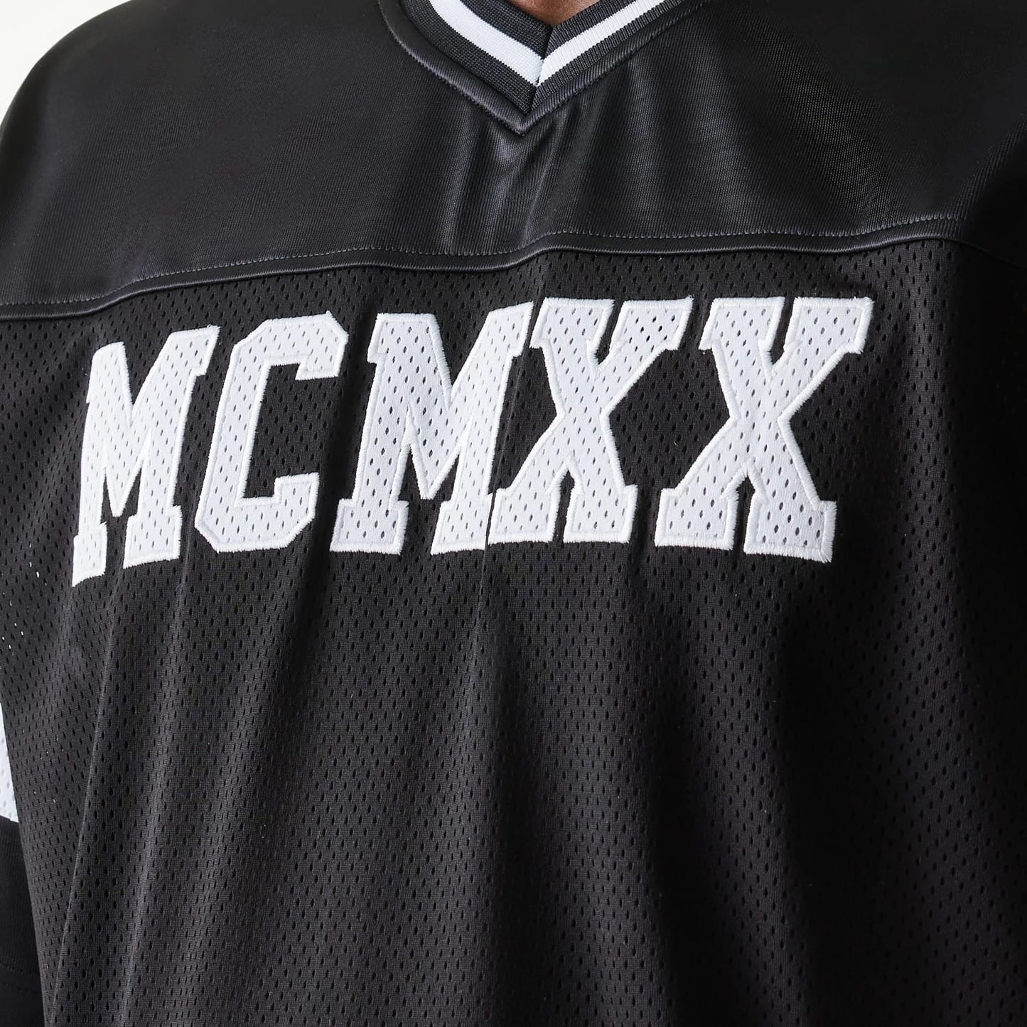 The Male model is wearing New Era Retro Sports Black Mesh Jersey 5