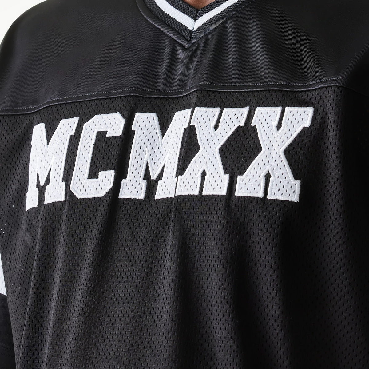 The Male model is wearing New Era Retro Sports Black Mesh Jersey 5
