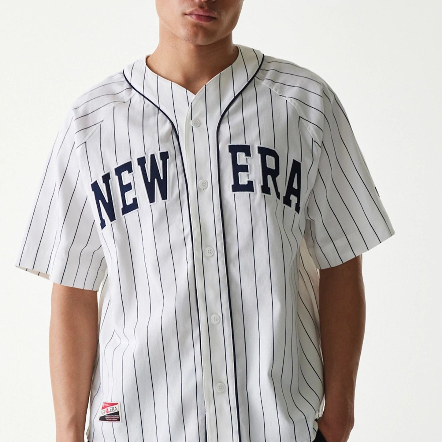 The Male model is wearing New Era Retro Baseball White Short Sleeve Shirt 3