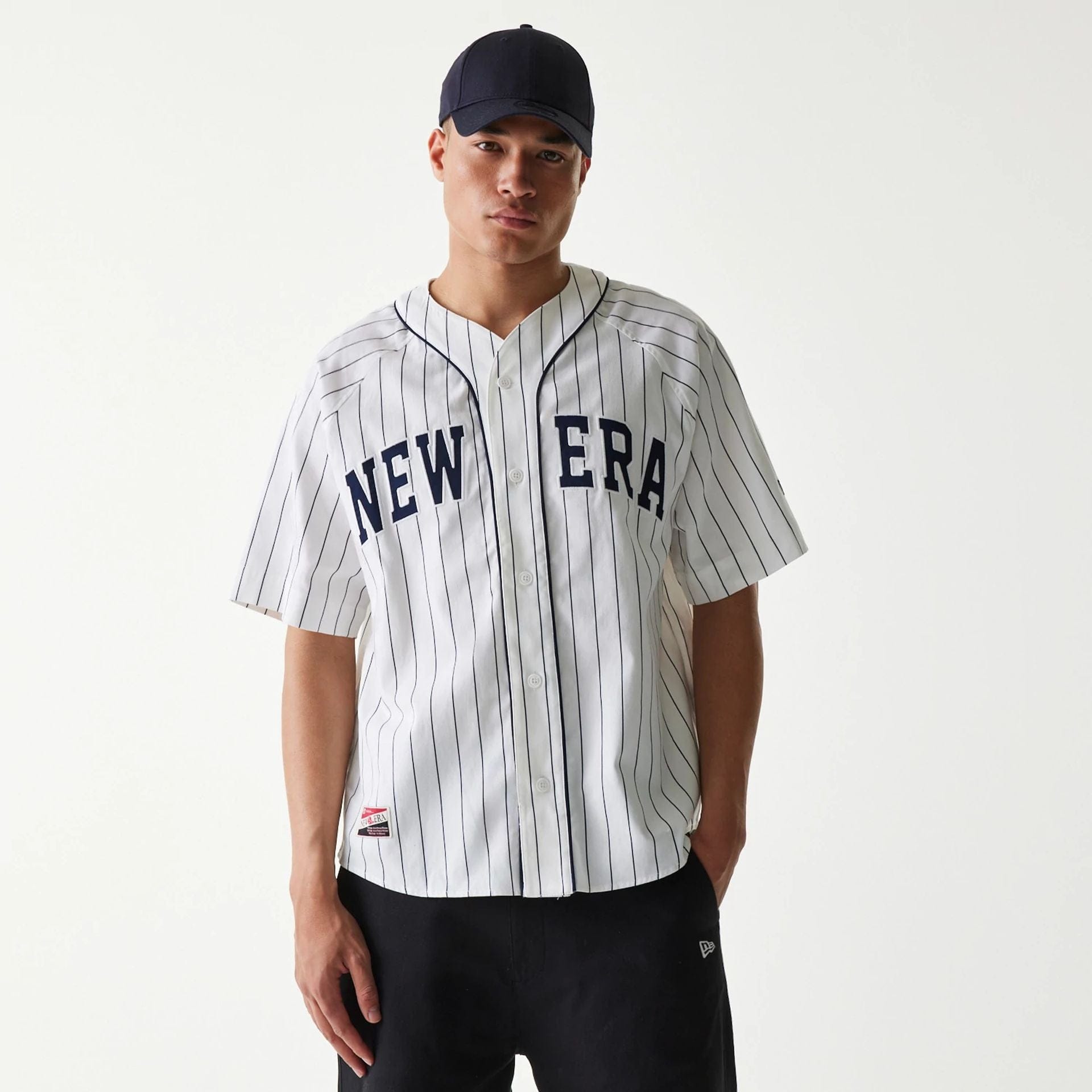 The Male model is wearing New Era Retro Baseball White Short Sleeve Shirt 1