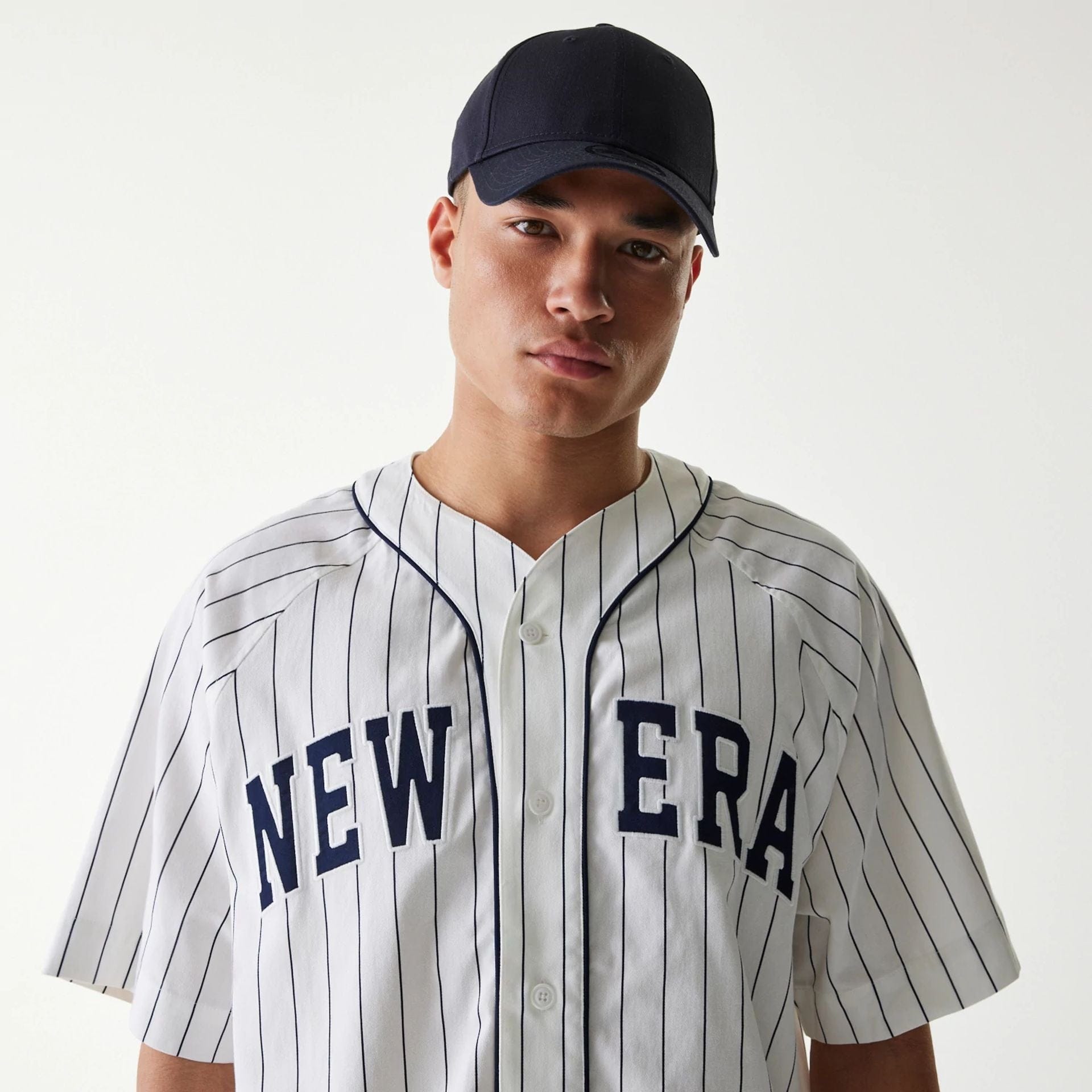 The Male model is wearing New Era Retro Baseball White Short Sleeve Shirt 4