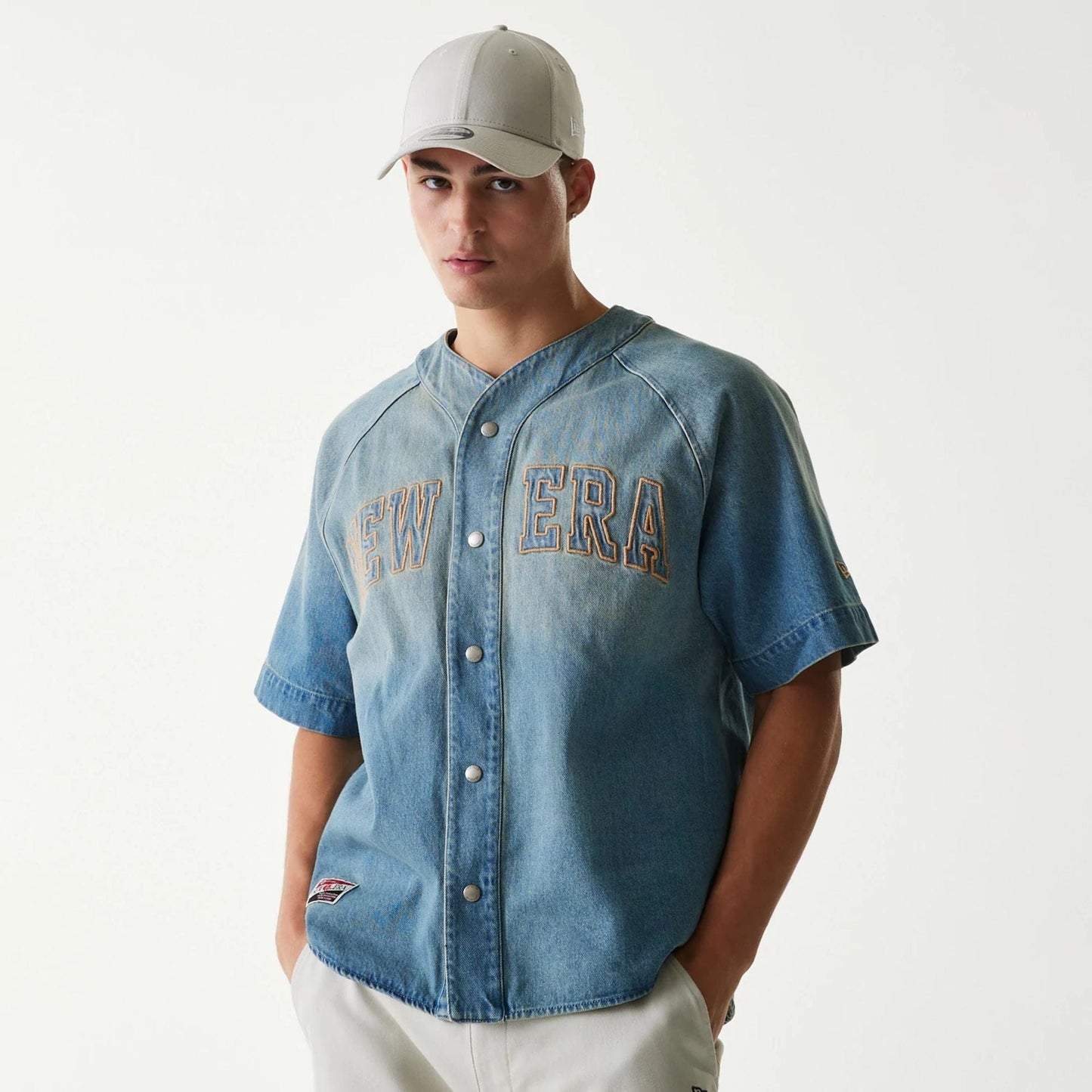 The Male model is wearing New Era Retro Baseball Blue Short Sleeve Shirt 1