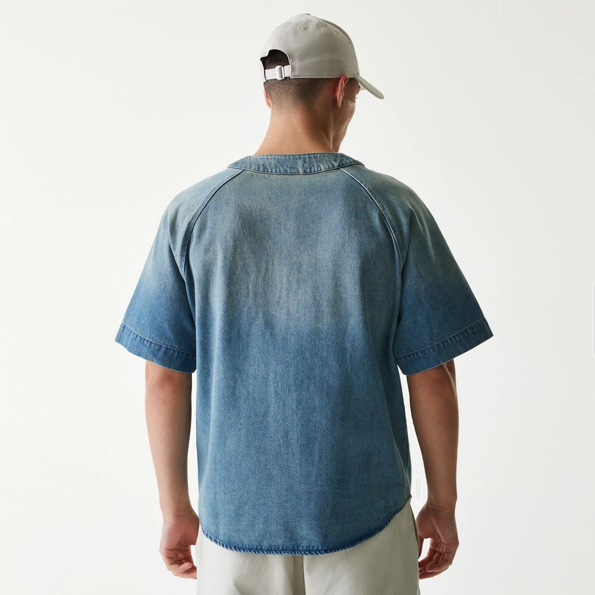 The Male model is wearing New Era Retro Baseball Blue Short Sleeve Shirt 2