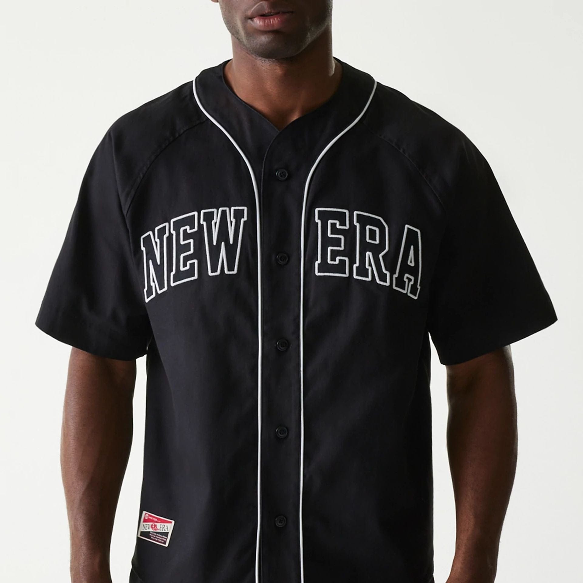 The Male model is wearing New Era Retro Baseball Black Short Sleeve Shirt 3