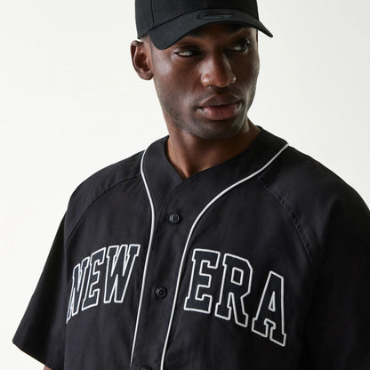 The Male model is wearing New Era Retro Baseball Black Short Sleeve Shirt 4