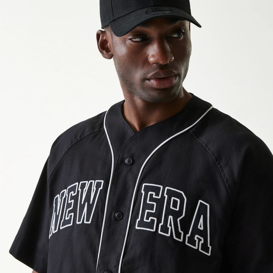 The Male model is wearing New Era Retro Baseball Black Short Sleeve Shirt 4