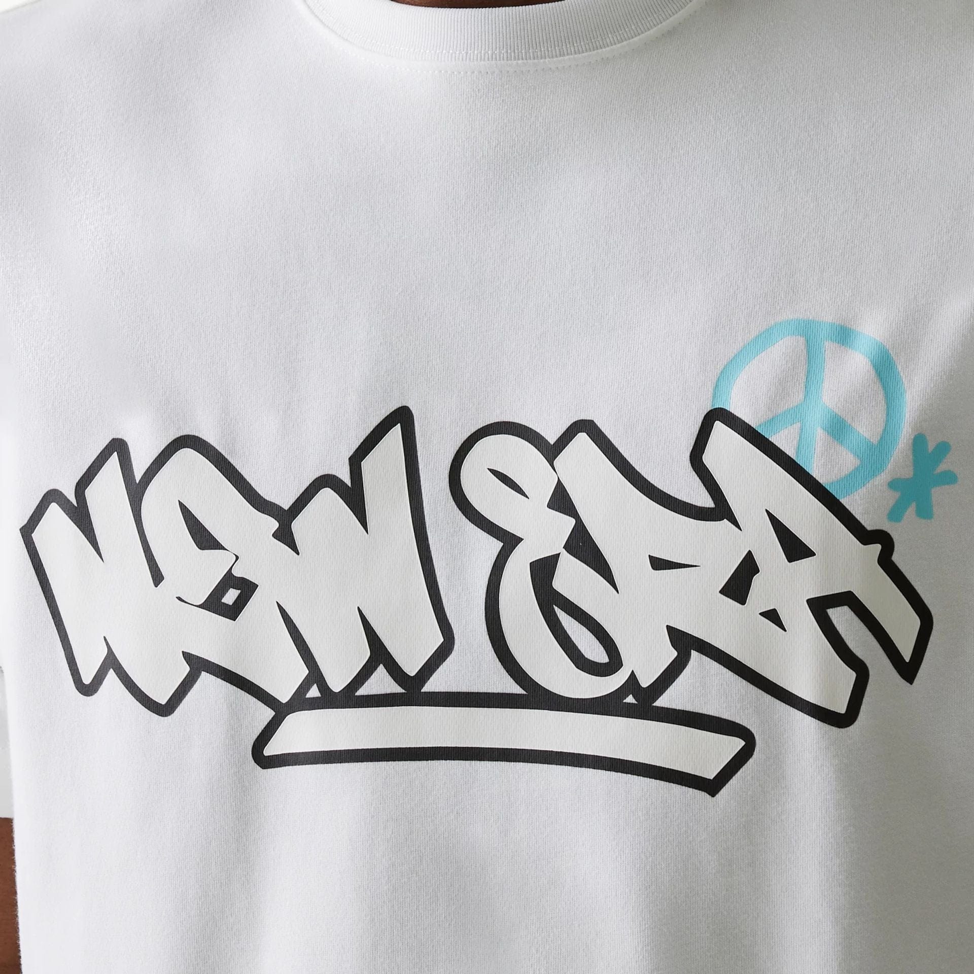 The Male model is wearing New Era Peace Symbol White T-Shirt 3