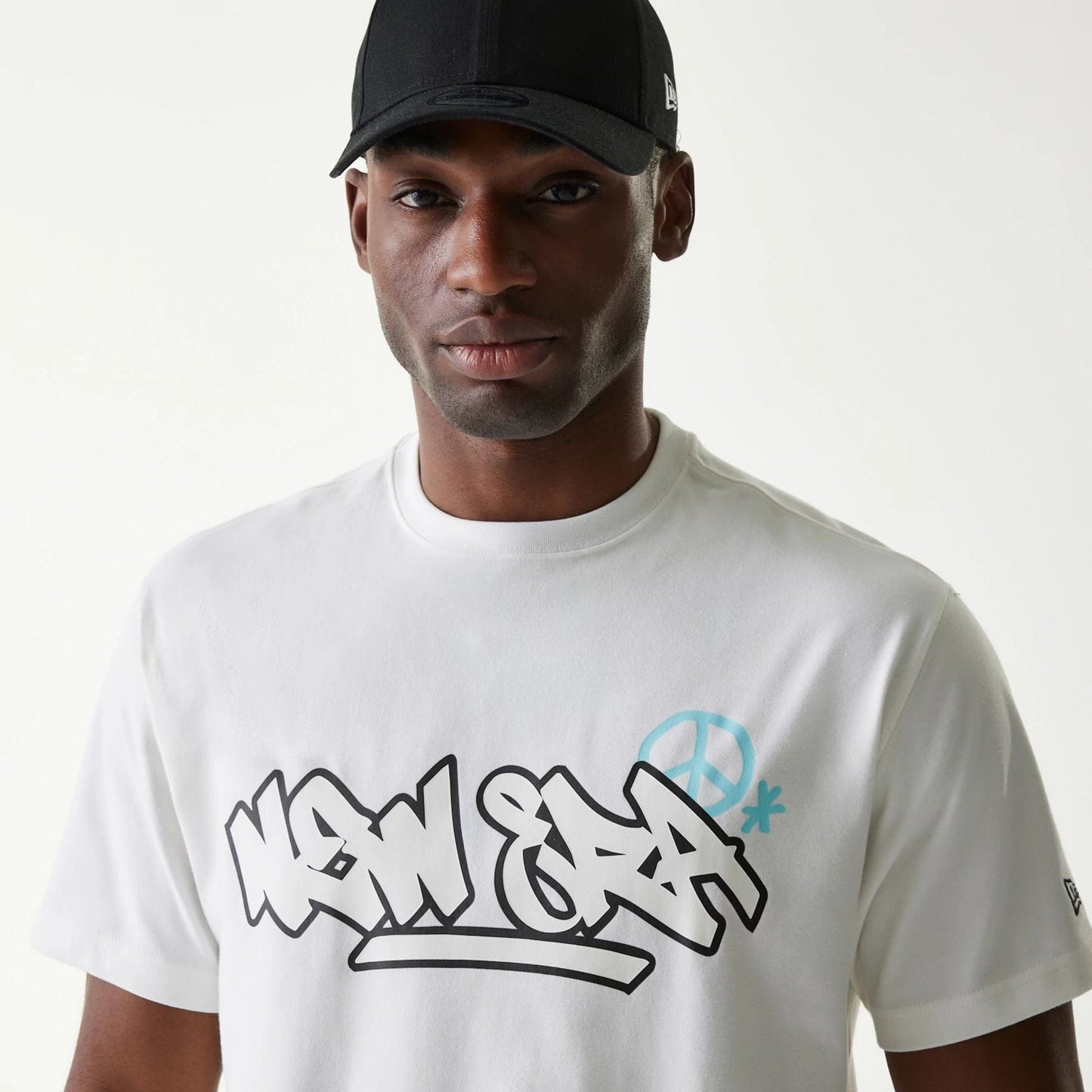 The Male model is wearing New Era Peace Symbol White T-Shirt 4
