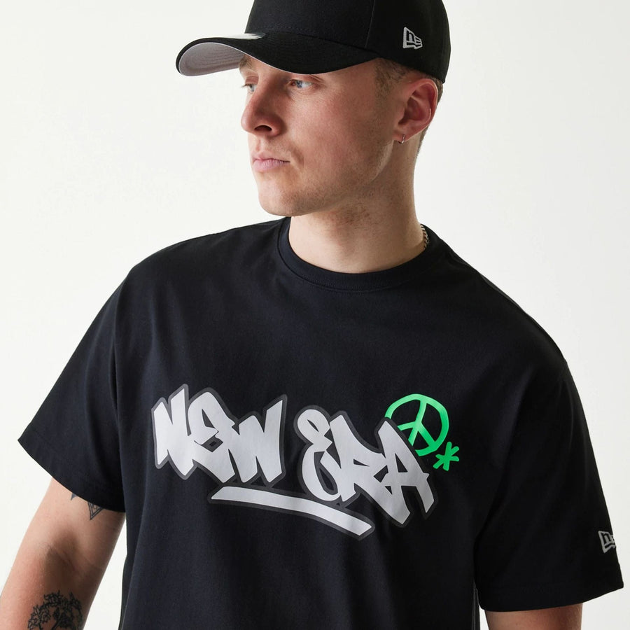 The Male model is wearing New Era Peace Symbol Black T-Shirt 3