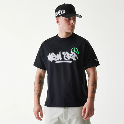 The Male model is wearing New Era Peace Symbol Black T-Shirt 1