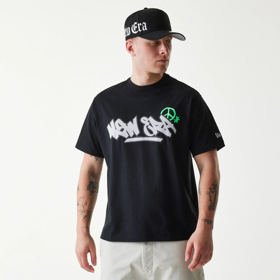 The Male model is wearing New Era Peace Symbol Black T-Shirt 1
