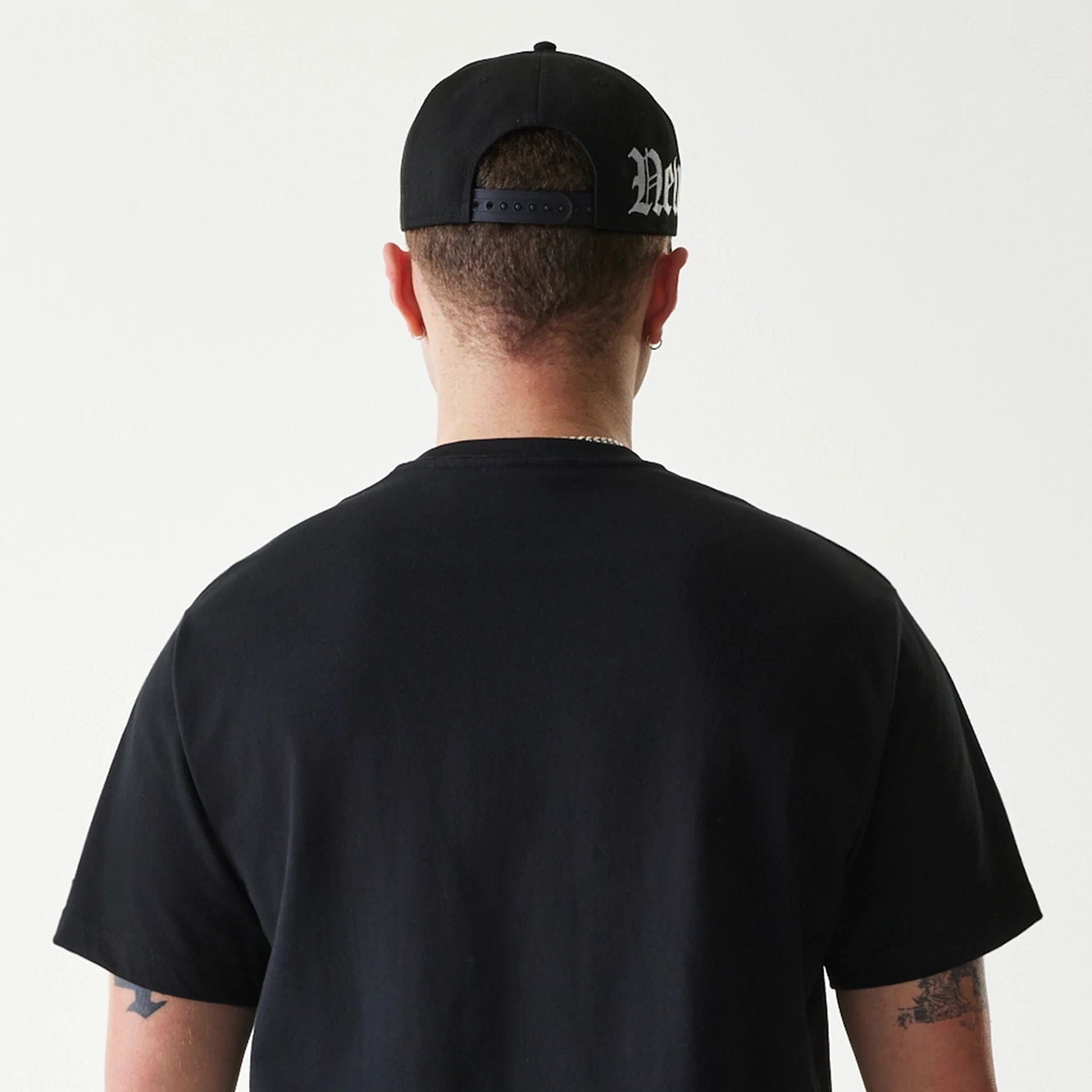 The Male model is wearing New Era Peace Symbol Black T-Shirt 7