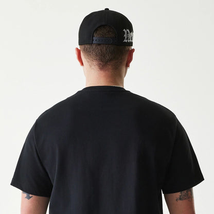 The Male model is wearing New Era Peace Symbol Black T-Shirt 7