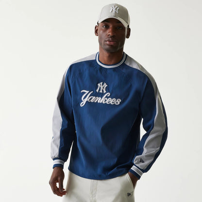 The Male model is wearing New York Yankees MLB Navy U Neck Pullover Windbreaker 1