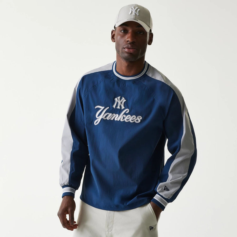 The Male model is wearing New York Yankees MLB Navy U Neck Pullover Windbreaker 1