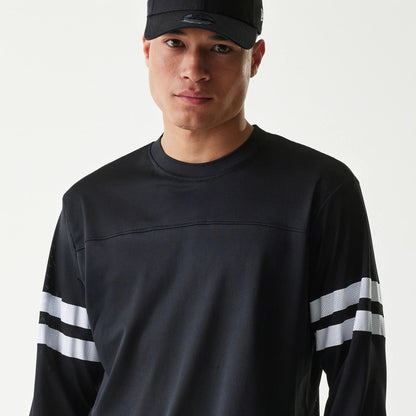 The Male model is wearing New Era Mesh Water Black Long Sleeve T-Shirt 3
