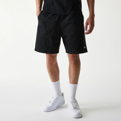 The Male model is wearing New Era Japan Woven Black Shorts 1