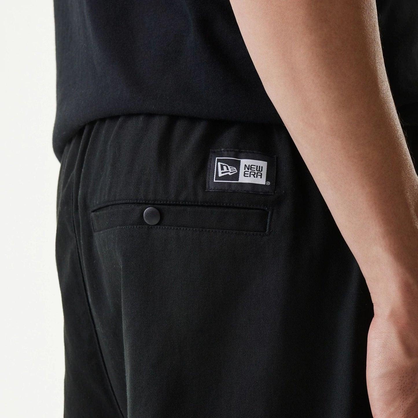The Male model is wearing New Era Japan Woven Black Shorts 5