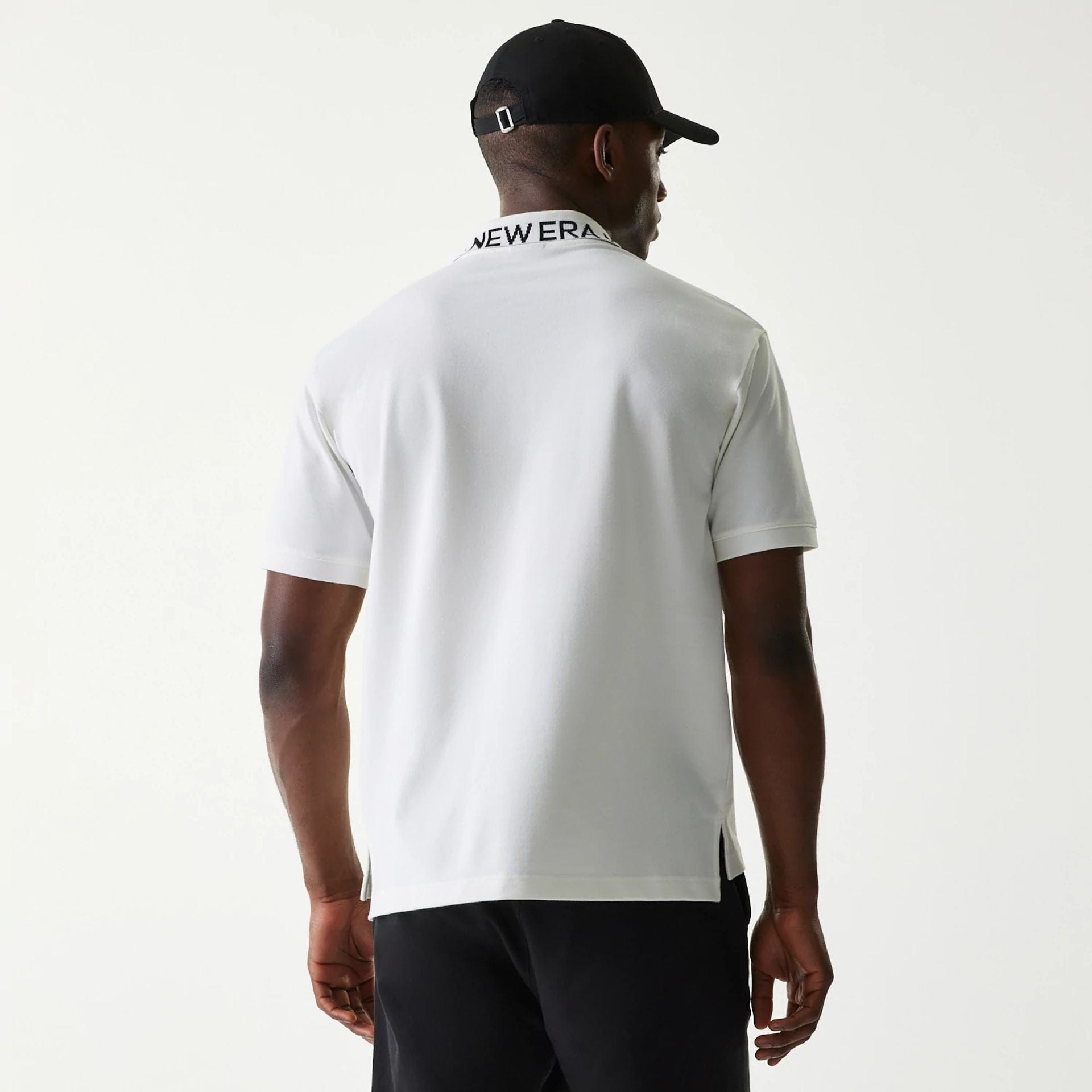 The Male model is wearing New Era Japan Collar Logo White Polo T-Shirt 2